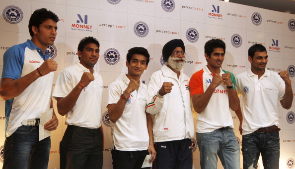 Gurbaksh Singh Sandhu, pictured here with India's boxers in the build-up to London 2012, has been persuaded to carry on until Rio 2016 @Hindustan Times via Getty Images