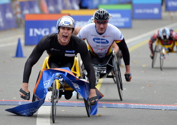 Marcel Hug crosses the line to win the men's wheelchair race at the 2013 New York City Marathon
