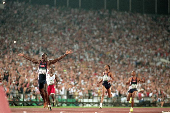 Michael Johnson wins his second gold of the 1996 Games, adding the 200m title in a world record of 19.32sec to his earlier 400m victory @Getty Images