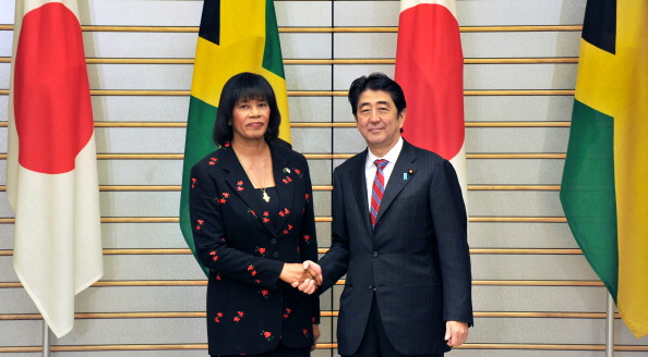 Portia Simpson-Miller, pictured with Japanese counterpart Shinzo Abe earlier this month, has promised improvement to WADA ©AFP / Getty Images