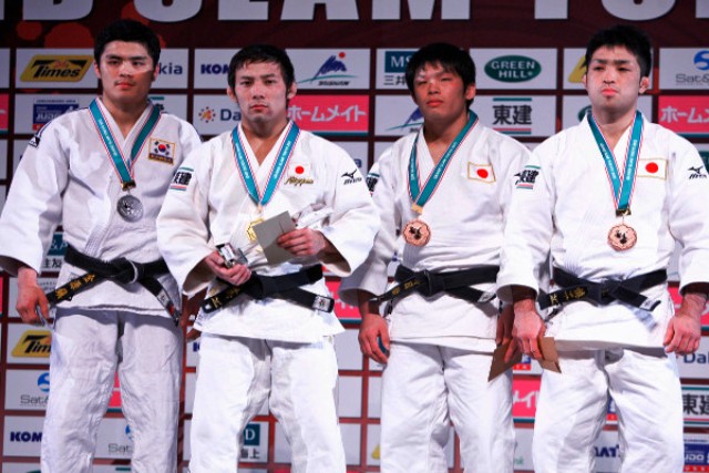 Reigning world champion Naohisa Takato (second from left) retained his Tokyo Grand Slam title in impressive fashion © IJF Media by G. Sabau
