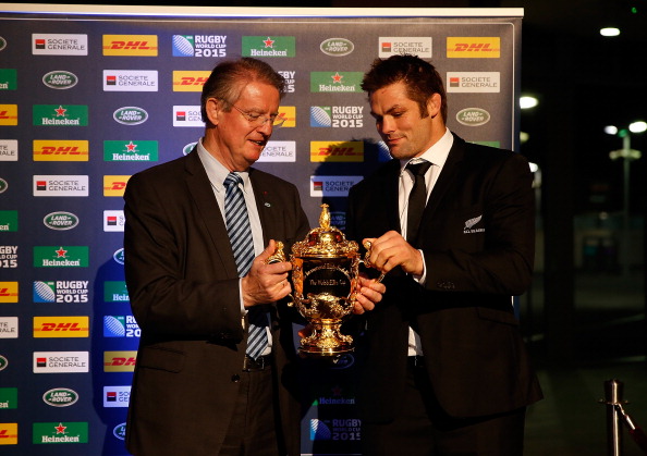 Richie McCaw hands the World Cup winners trophy back to IRB chairman Bernard Lapasset ©Getty Images