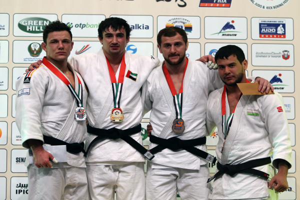 Sergiu Toma stands on top of the podium after securing a second gold medal of the week for the UAE ©IJF