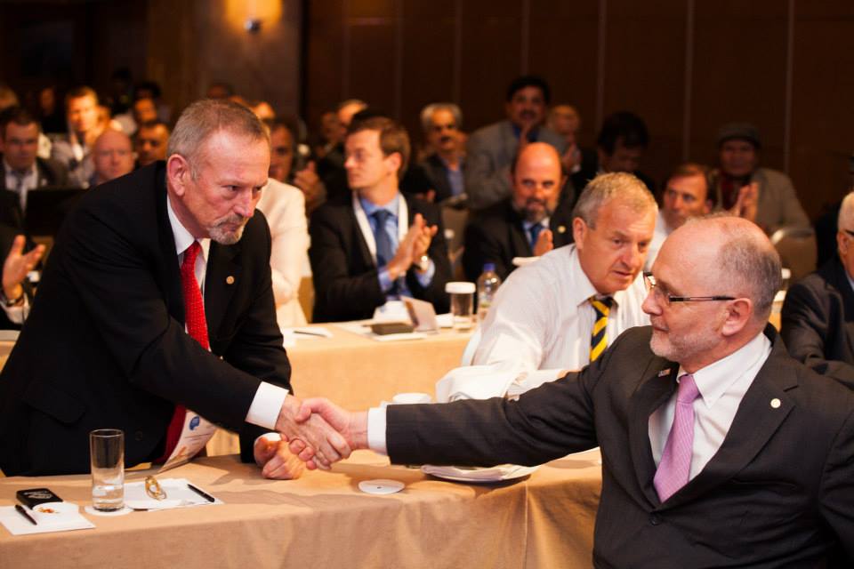 Sir Philip Craven is congratulated by challenger Alan Dickson after his victory in the IPC Presidential contest ©George Santamouris