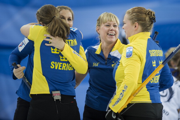 Sweden celebrate following their victory over world champions Scotland ©AFP/Getty Images