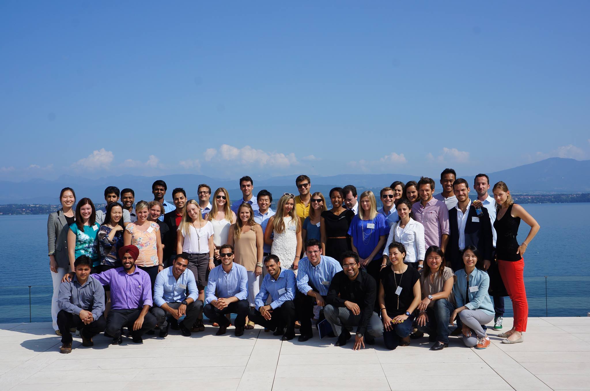 The AISTS MSA class of 2013 pose on the roof of the UEFA building in front of Lake Geneva © AISTS