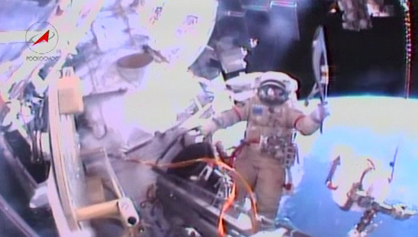 The Torch embarks on its first spacewalk around the International Space Station in the hands of Russian cosmonaut Oleg Kotov