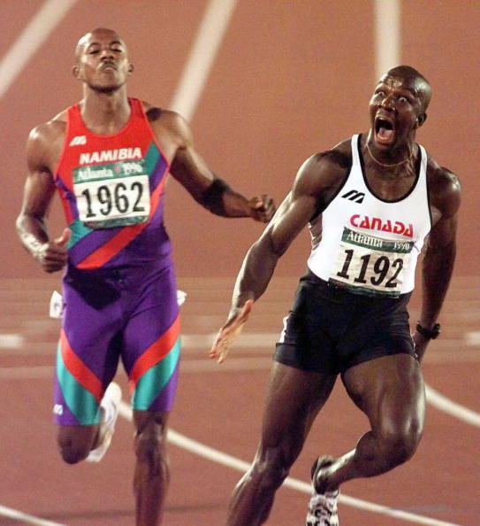Donovan Bailey reacts after winning 100m gold ahead of Frankie Fredericks in a world record of 9.84sec at the Atlanta Olympics @Getty Images