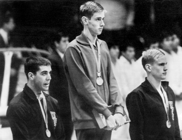 Mitch Ivey (left), pictured receiving his Olympic silver medal at Mexico City, is accused of sexual misconduct stretching back to the 1980s ©AFP/Getty Images