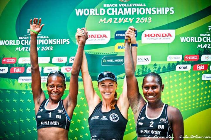 Lauren McLeod, flanked by Miller Elwin (left) and Henriette Iatika, celebrate their achievement at this year's World Beach Volleyball Championship in Poland, where they finished ninth