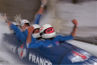 Driver Bruno Mingeon and his French four-man team celebrate bronze at the Nagano 1998 Olympics ©Getty Images