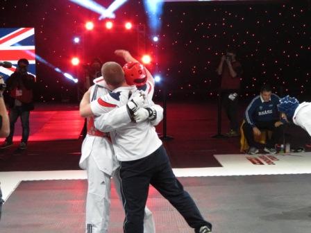 Cho celebrates with his coach following his victory in the 80kg final of the World Taekwondo Grand Prix in Manchester ©ITG