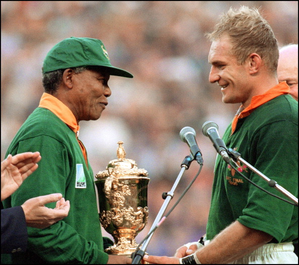 Nelson Mandela handing the Rugby World Cup to South Africa's winning captain Francois Pienaar in Johannesburg in 1995 must rank as one of the greatest sporting moments ever ©AFP/Getty Images