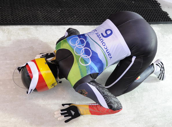 Tatjana Hüfner kisses the Whistler track after winning Olympic gold in the luge at Vancouver 2010 ©Getty Images