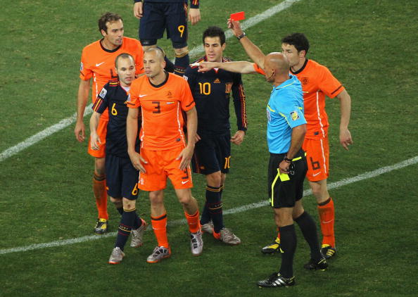 Howard Webb shows John Heitinga of the Netherlands a red card following his second bookable offence during the 2010 FIFA World Cup in South Africa ©Getty Images