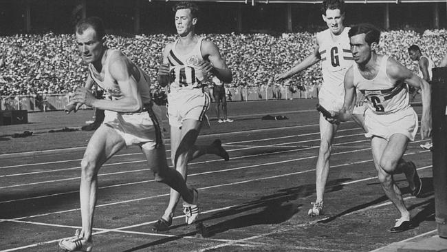 Kevan Gosper (left) helping Australia take the silver medal in the 4x400m relay at the 1956 Olympics in Melbourne ©Hulton Archive/Getty Images