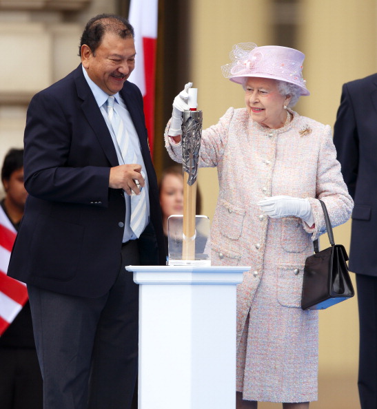 Prince Tunku Imran, seen here at the start of the Queen's Baton Relay for the 2014 Commonwealth Games in Glasgow, has warned that a decision must be taken on where to locate the headquarters ©Getty Images