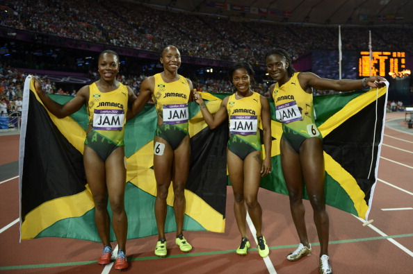 Sherone Simpson celebrates her Olympic silver medal from London 2012 with her relay team ©AFP/Getty Images