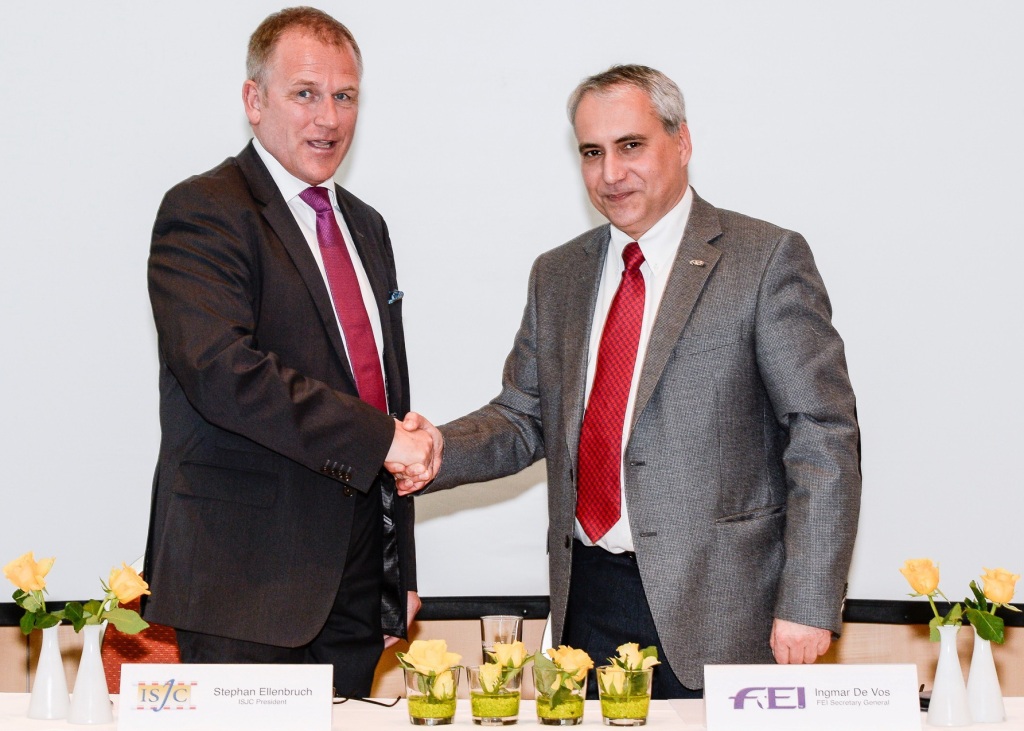 Stephan Ellenbruch and Ingmar De Vos celebrate the signing of the ISJC's Memorandum of Understanding with the FEI ©Carlo Stuppia/FEI