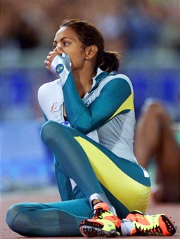 A stunned Cathy Freeman takes in her achievement in winning the Olympic 400m title in front of a home crowd at the Sydney 2000 Games ©AFP/ Getty Images