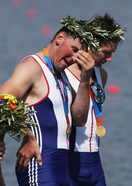 Sir Matthew Pinsent is overcome with emotion after winning his fourth Olympic gold in the four at the Athens 2004 Games - his teammate Ed Coode, who had missed out four years earlier, stands alongside him ©Getty Images