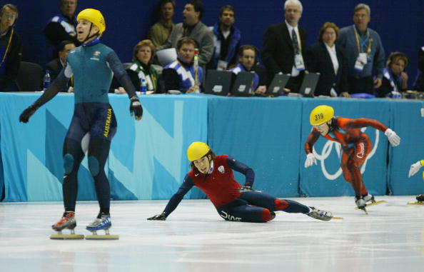 Australia's Steven Bradbury, last man standing in the 1,000m short track speed skating final at the 2002 Salt Lake Winter Games, glides over the line to claim gold ©Getty Images