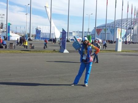 A volunteer helpfully points out the Olympic Flame for those who missed it ©ITG