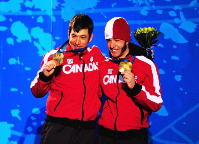 Brian McKeever (right) and brother Robin celebrate one of three gold medals at Vancouver 2010 ©Getty Images 