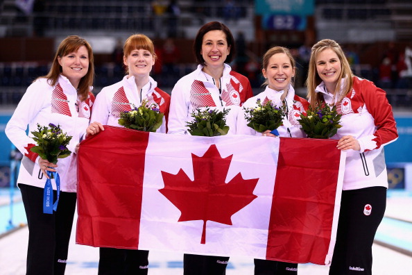 Canada celebrate after going through the entire competition unbeaten to win the curling gold medal ©Getty Images