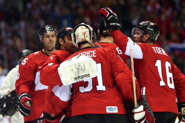 Canada celebrate after their overtime ice hockey victory over Finland ©Getty Images