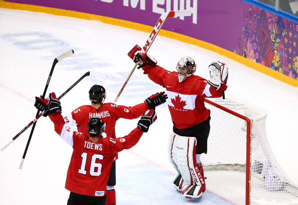 Canada players celebrate after beating Sweden to secure a historic title defence ©Getty Images