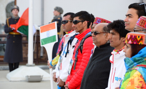 New Indian Olympic Association President Narayna Ramachandran (third from right) and athletes attended the Indian flag raising ceremony at the Mountain Olympic Village ©Getty Images