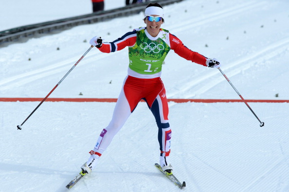 Marit Bjoergen crosses the line first as Norway win the team sprint classic cross country ©AFP/Getty Images