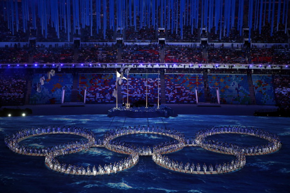 Performers make the shape of the Olympic Rings having initially recreated the "missing" Ring from the Opening Ceremony ©Getty Images