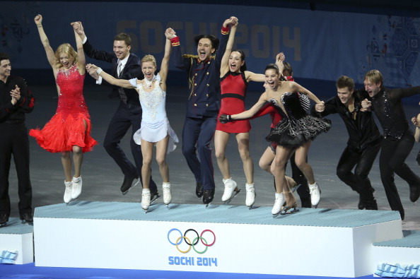 Russia leap on to the podium to collect the first ever team figure skating gold medal ©Toronto Star/Getty Images