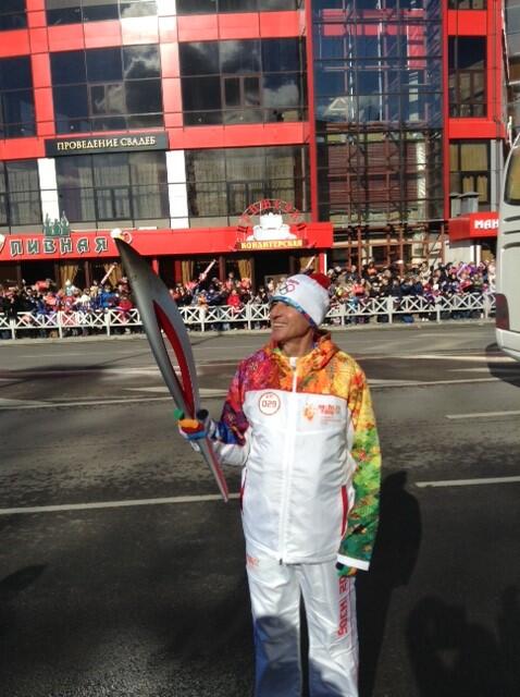 Former London 2012 chairman Sebastian Coe with the Olympic Torch in Sochi ©Twitter