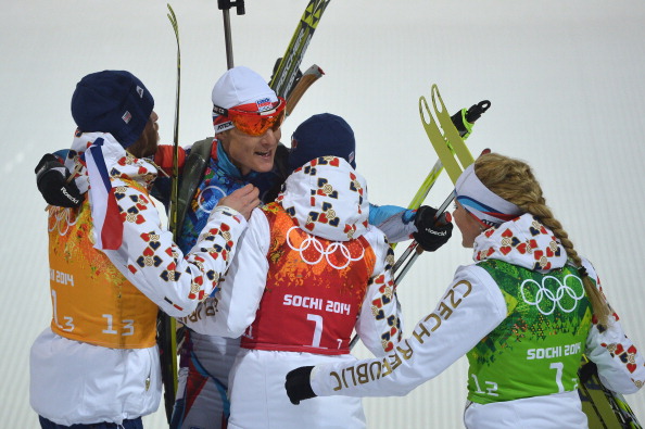 The Norwegians, including Bjoerndalen, win the first ever gold medal in mixed team biathlon ©AFP/Getty Images
