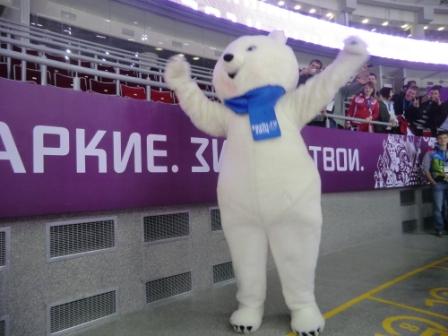 The Sochi 2014 polar bear mascot enjoying plenty of attention at the ice hockey ©Philip Barker