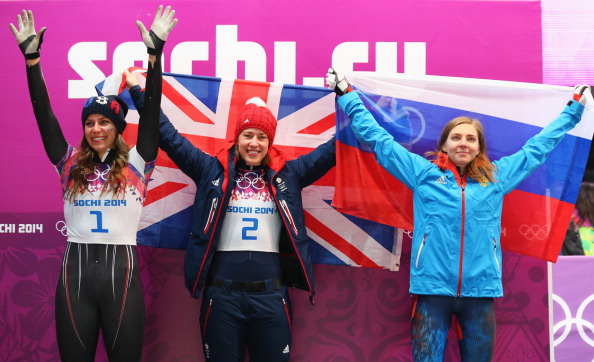 The three medal winners celebrate following the finish of the women's skeleton ©Getty Images