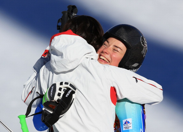 The two gold medal winners embrace following their historic tie for gold ©Getty Images