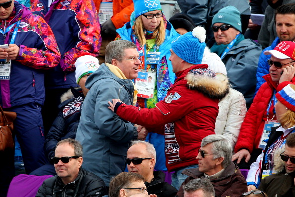Thomas Bach and Dmitry Medvedev share a conversation, I assume, about the technicalities of downhill skiing ©Getty Images