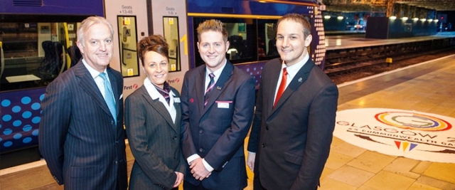 Tim O’Toole of FirstGroup (left), which runs ScotRail, joins Glasgow 2014 chief executive David Grevemberg (right) and ScotRail staff at today's announcement ©Glasgow 2014