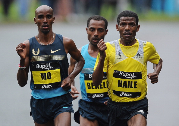 Haile Gebrselassie (right) thinks Mo Farah (left) would get the best out of himself if he sticks to track running ©Getty Images