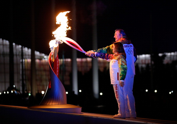 Russian icons Vladislav Tretiak and Irina Rodnina lit the Olympic cauldron ©Getty Images