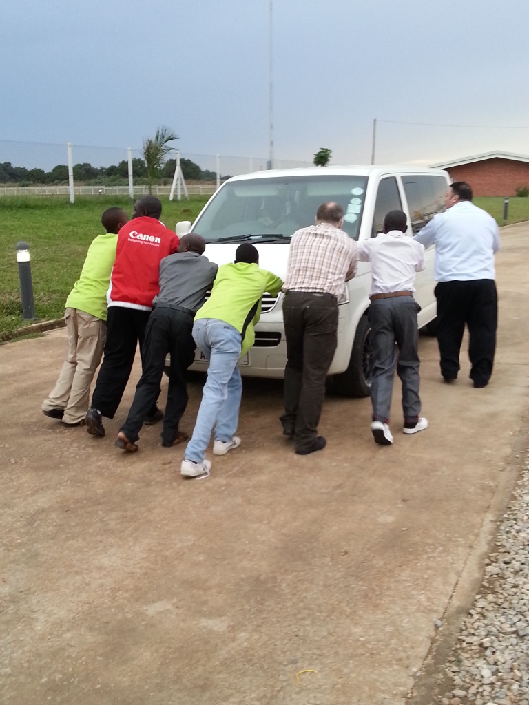 A group of Zambians showing their warmth and kindness as they help push our car after it broke down outside the workshop ©ITG