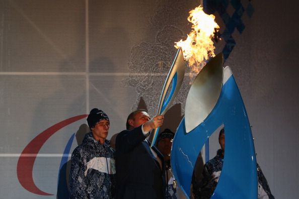 Anatoly Pakhomov  lights the Sochi 2014 Paralympic Torch at Rosa Khutor ©Getty Images