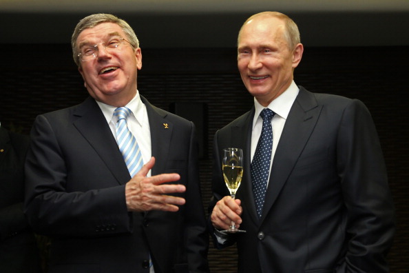 IOC President Thomas Bach and Russian President Vladimir Putin sharing a joke backstage ahead of the Opening Ceremony of the Paralympics ©Getty Images