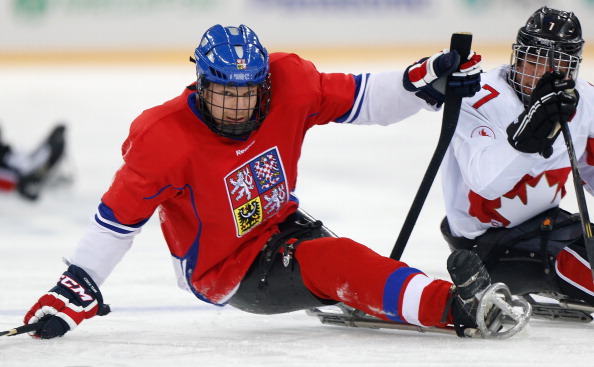 Czech and Canadian players battle it out in the second period of their ice sledge hockey clash ©Getty Images