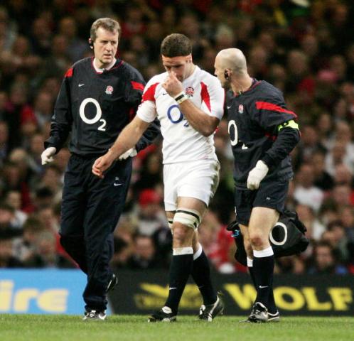 Former England player Joe Worsley is helped from the pitch after suffering a concussion during a Six Nations Championship match ©Getty Images