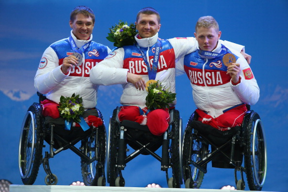 From left, silver medallist Alexey Bychenok, gold medallist Roman Petushkov and bronze medallist Grigiry Murygin celebrate their Russian 1-2-3 in the men's 12.5km sitting biathlon ©Getty Images